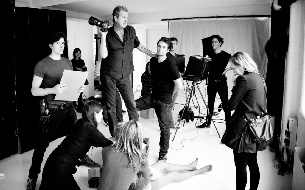 : Mario Testino and the photoproduction team on set